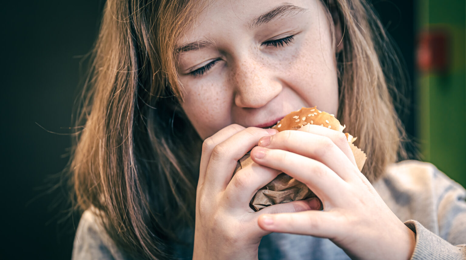 Woman eating a burger Woman eating a burger