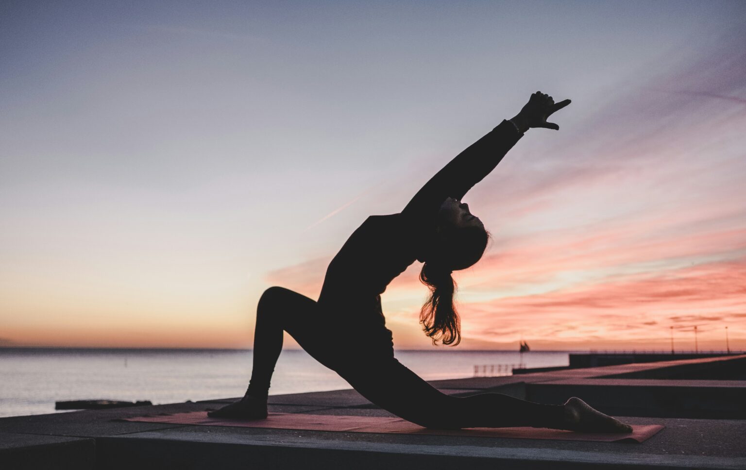 A person doing yoga outdoors